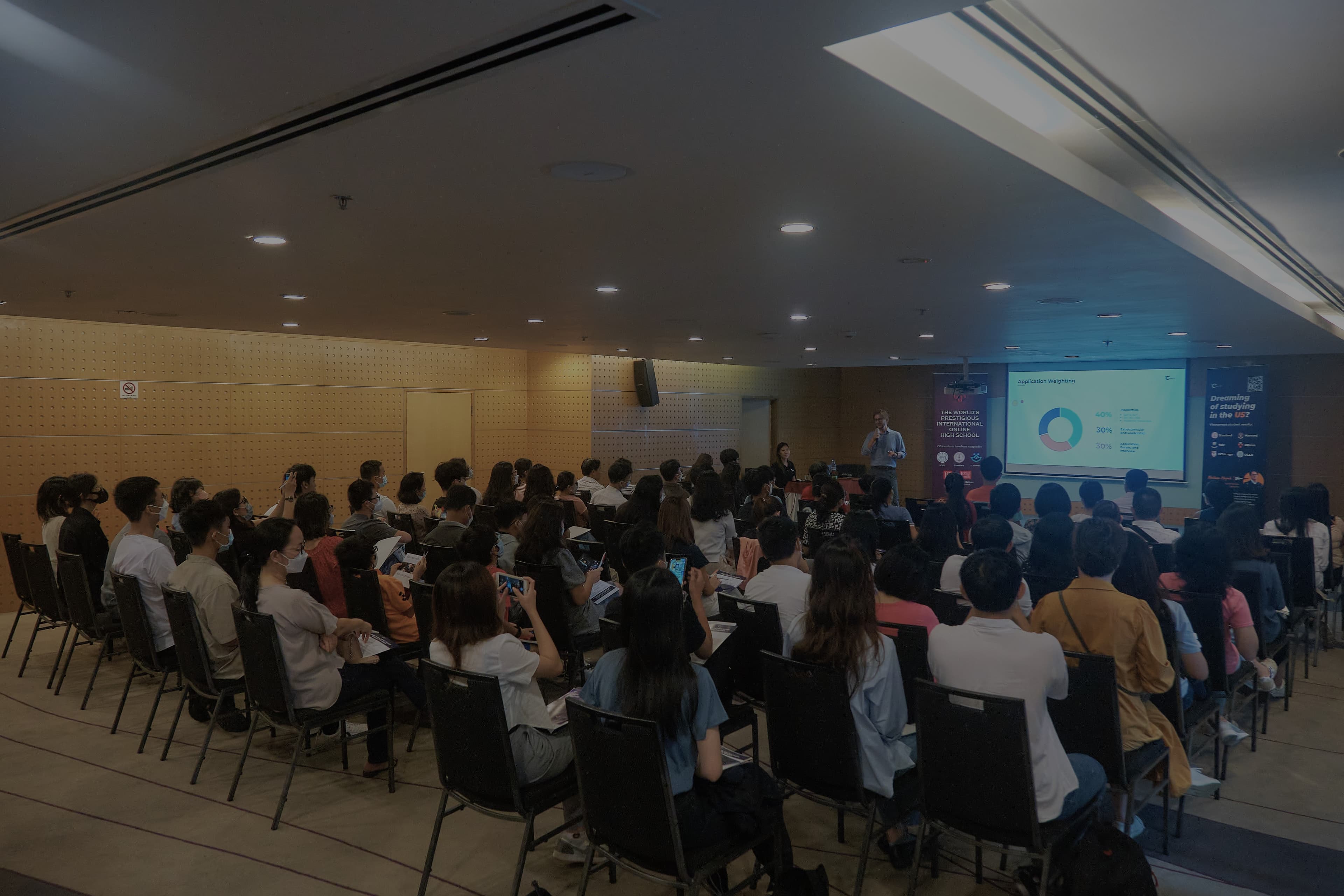 Group of families listening to a seminar presentation