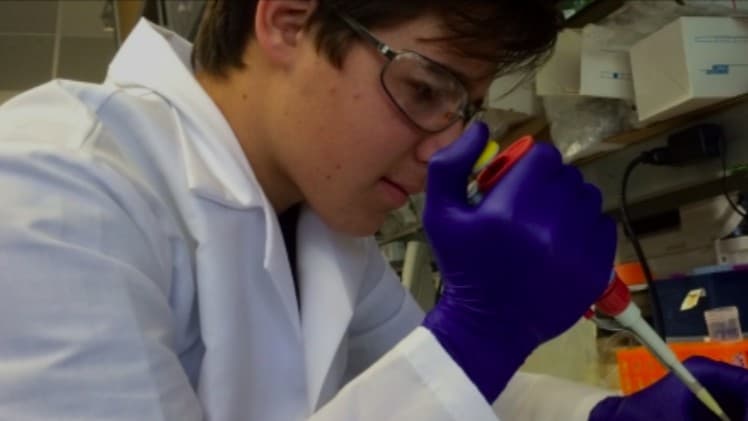 Student doing lab work at a Stanford summer research institute